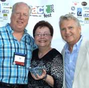 Directors Tom Booth and Lynn Nelson accept the People’s Choice Award for Favorite Production