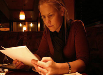 A Playwright reading a script